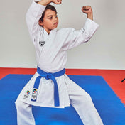 White martial arts uniform with blue belt, long sleeves and wrap-style jacket