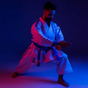 Martial arts gi set worn with jacket and pants and matching belt