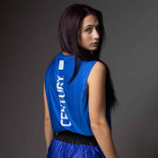 Blue sleeveless tee with white vertical logo print on the back