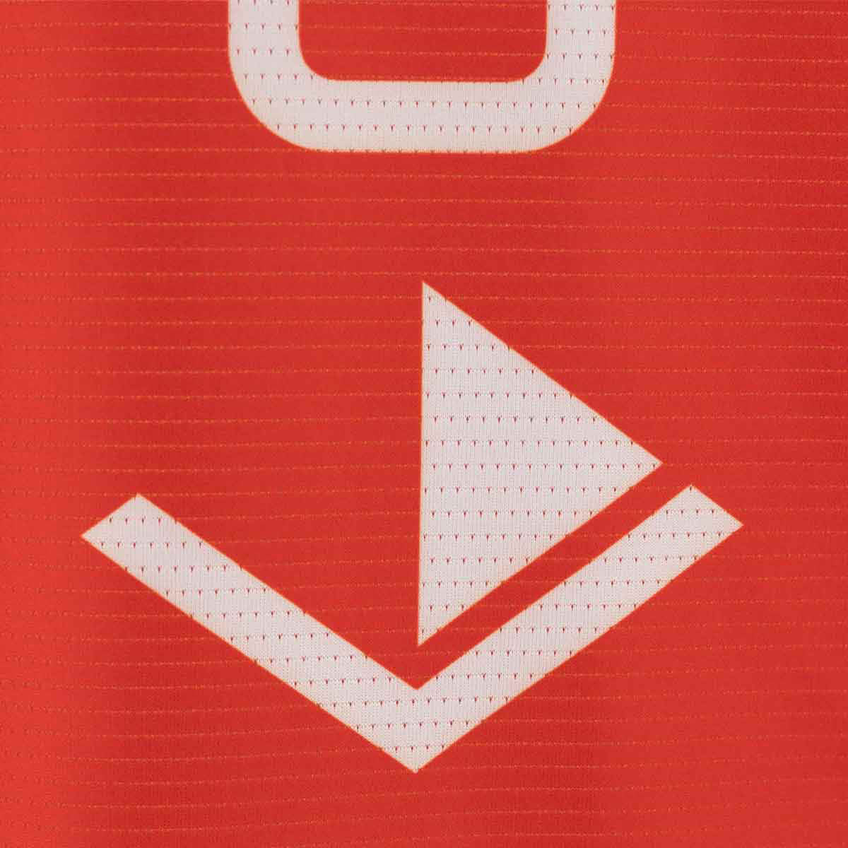 Red sleeveless tee close-up: white emblem logo graphic