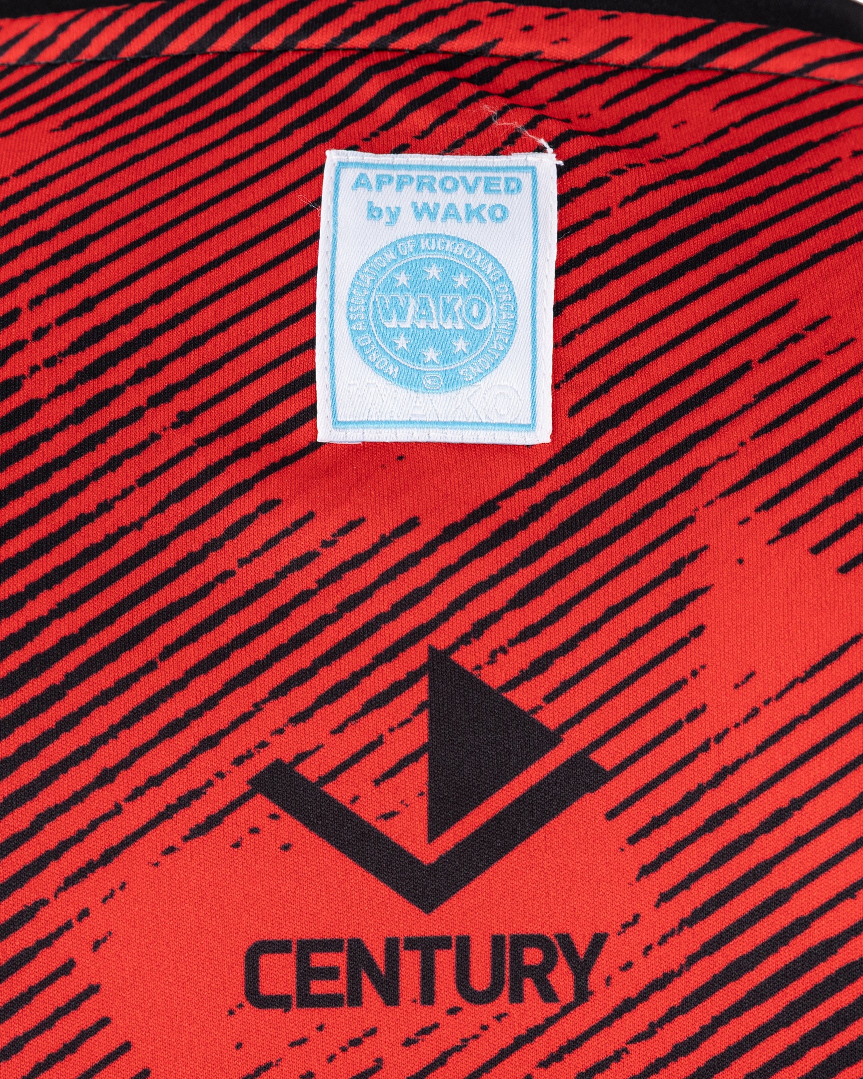 Men's red sleeveless tee with WAKO approved label and CENTURY logo