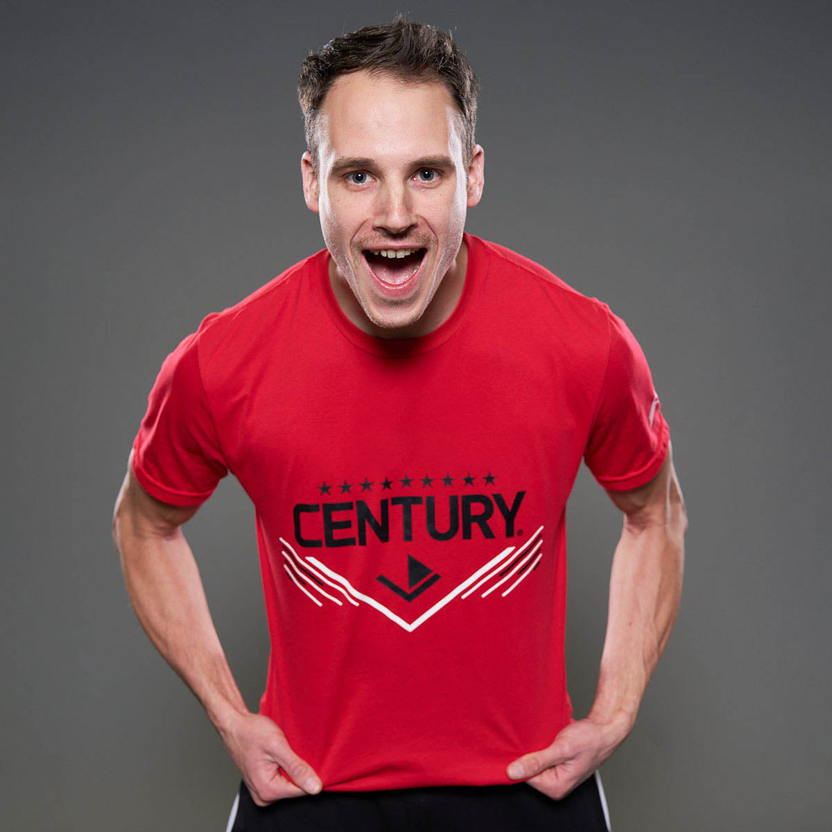 Red unisex t-shirt with front CENTURY logo graphic, worn by model
