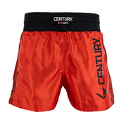 Red kickboxing shorts with black elastic waistband; Century logo patch and side “CENTURY” print.