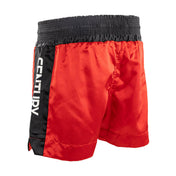 Red kickboxing shorts with black side stripe and elastic waistband