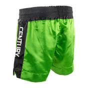 WAKO kickboxing shorts in neon green, side view with black stripe logo panel