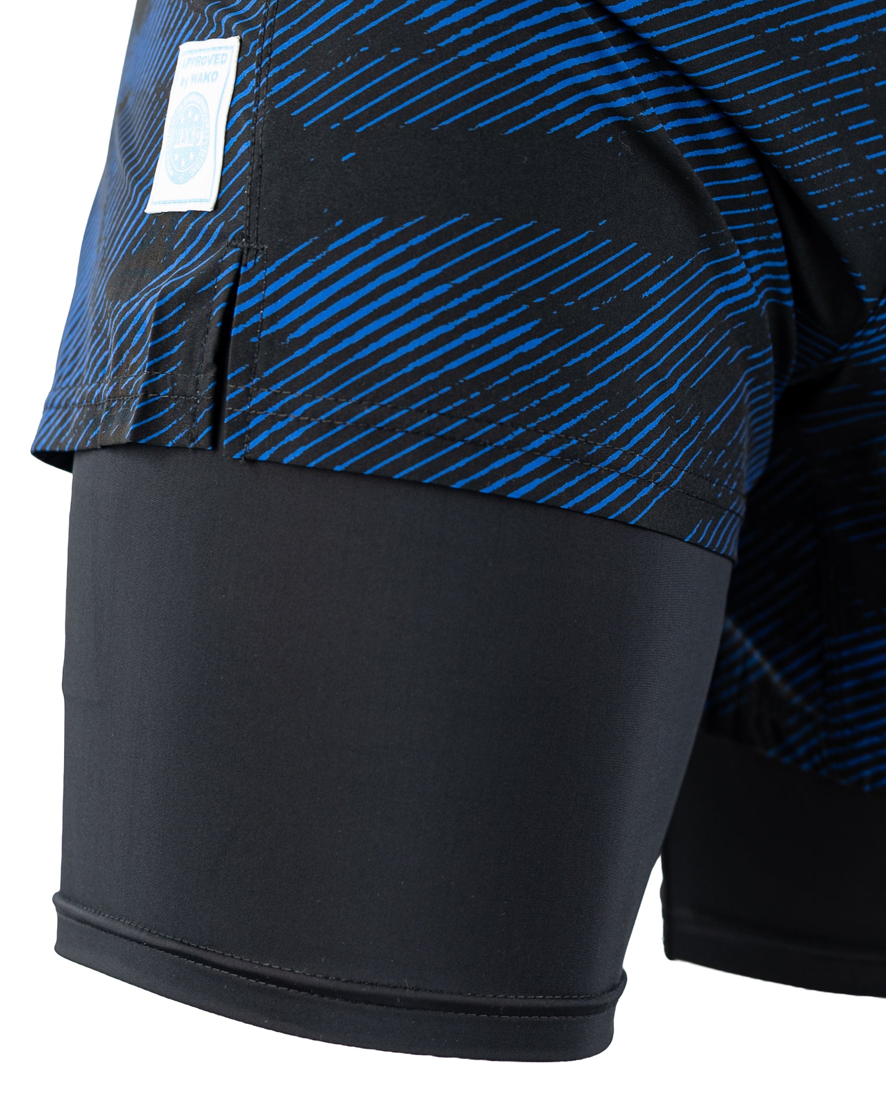 Men's blue patterned training shorts with black hem panels and side seam detail.