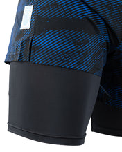 Men's blue patterned training shorts with black hem panels and side seam detail.