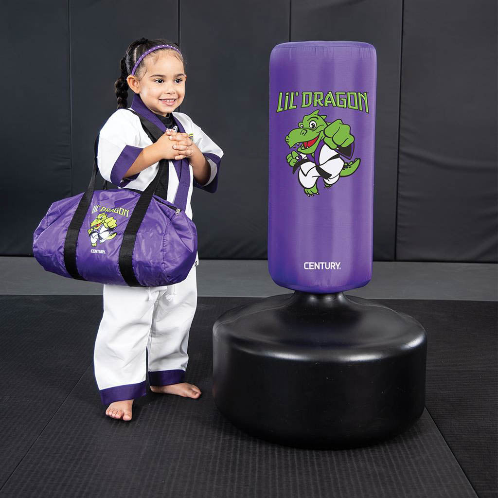 Purple kids punching bag with dragon logo, on black round base