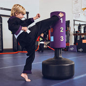 Purple kids punching bag with dragon logo and numbered targets, on black base