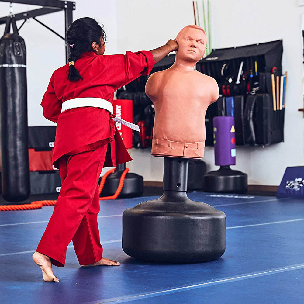 Brown padded boxing training dummy torso with black base