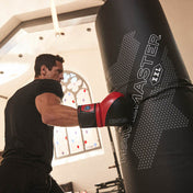 Black WaveMaster punching target cylinder with logo, with a red boxing glove