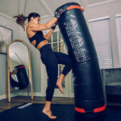 Punching training bag in black with red trim and Century logo panel