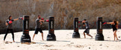 Outdoor training set of black Century Torrent T2 Pro freestanding punching bags