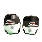 White-and-black ankle kick pads with green logo accents and Century branding
