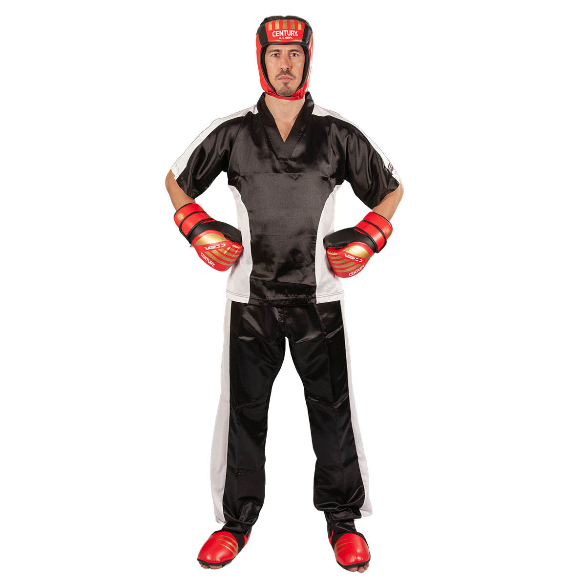 Red boxing kick pads on a standing fighter with black uniform and red gloves