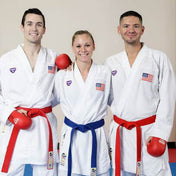 Karate practitioners wearing Punok WKF-approved gloves with red and blue colors