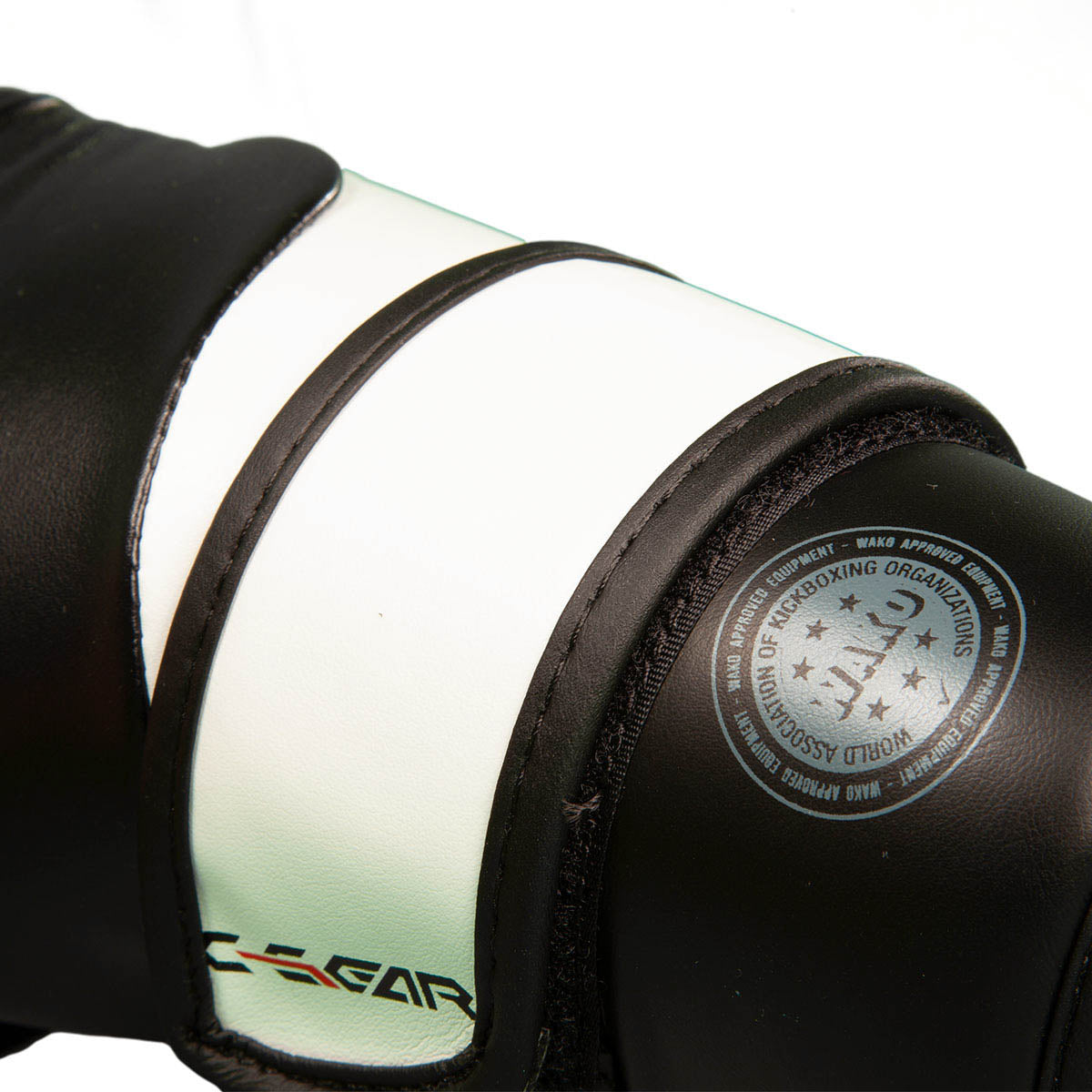 Boxing punch glove detail, black and mint with round stamped logo on cuff