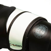 Boxing punch glove detail, black and mint with round stamped logo on cuff