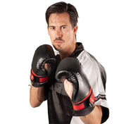 Pair of black boxing gloves with red trim and Century logo, worn for sparring