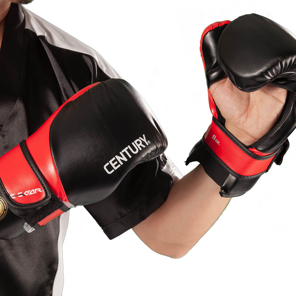 Black boxing gloves with red accents and Century logo on the backs