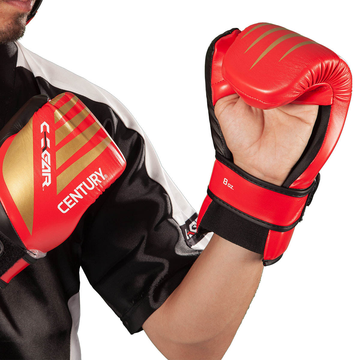 C-Gear boxing glove on fighter’s fist, red padding with black wrist strap