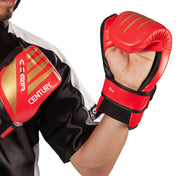C-Gear boxing glove on fighter’s fist, red padding with black wrist strap