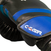 Close-up of a black and blue kickboxing glove showing the C-Gear branding on the pad.