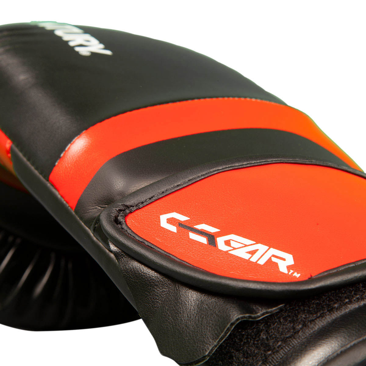 Kickboxing punch glove close-up with orange stripe, black padding, and C-GEAR logo