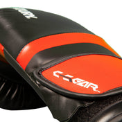 Kickboxing punch glove close-up with orange stripe, black padding, and C-GEAR logo