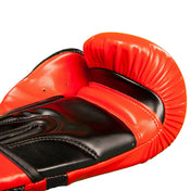 Red and black kickboxing gloves with padded thumb and curved hook-and-loop wrist strap