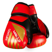 Red and black kickboxing gloves, angled view showing wrist cuff and logo