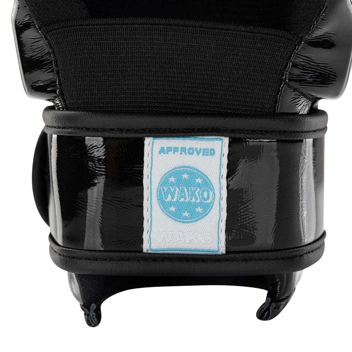 Black boxing glove close-up with glossy cuff and blue 'WAKO approved' patch