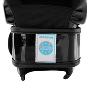 Black boxing glove close-up with glossy cuff and blue 'WAKO approved' patch