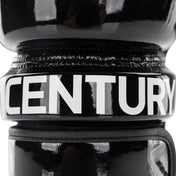 Black boxing glove close-up showing bold 'CENTURY' branding on the wrist band
