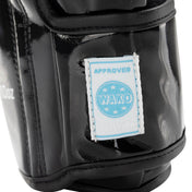 Black Valor kickboxing glove close-up with Approved WAko label on wrist