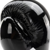 Black Valor kickboxing glove close-up of glossy knuckle area with seam details