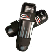 Black boxing shin guards with white and gray stripe panels and black straps