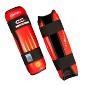 Red and black shin guards pair, side view with black backing and hook straps