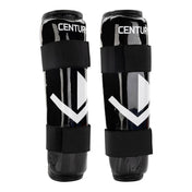 Front pair of black shin guards with white chevron graphics and wide hook straps