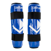 Front pair of blue shin guards with white chevron graphics and wide hook straps