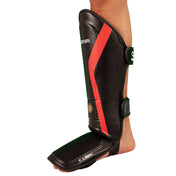 Black shin and instep guard with red stripe, green straps, and protective foot pad