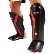 Black shin instep guards with red side stripe and hook-and-loop straps
