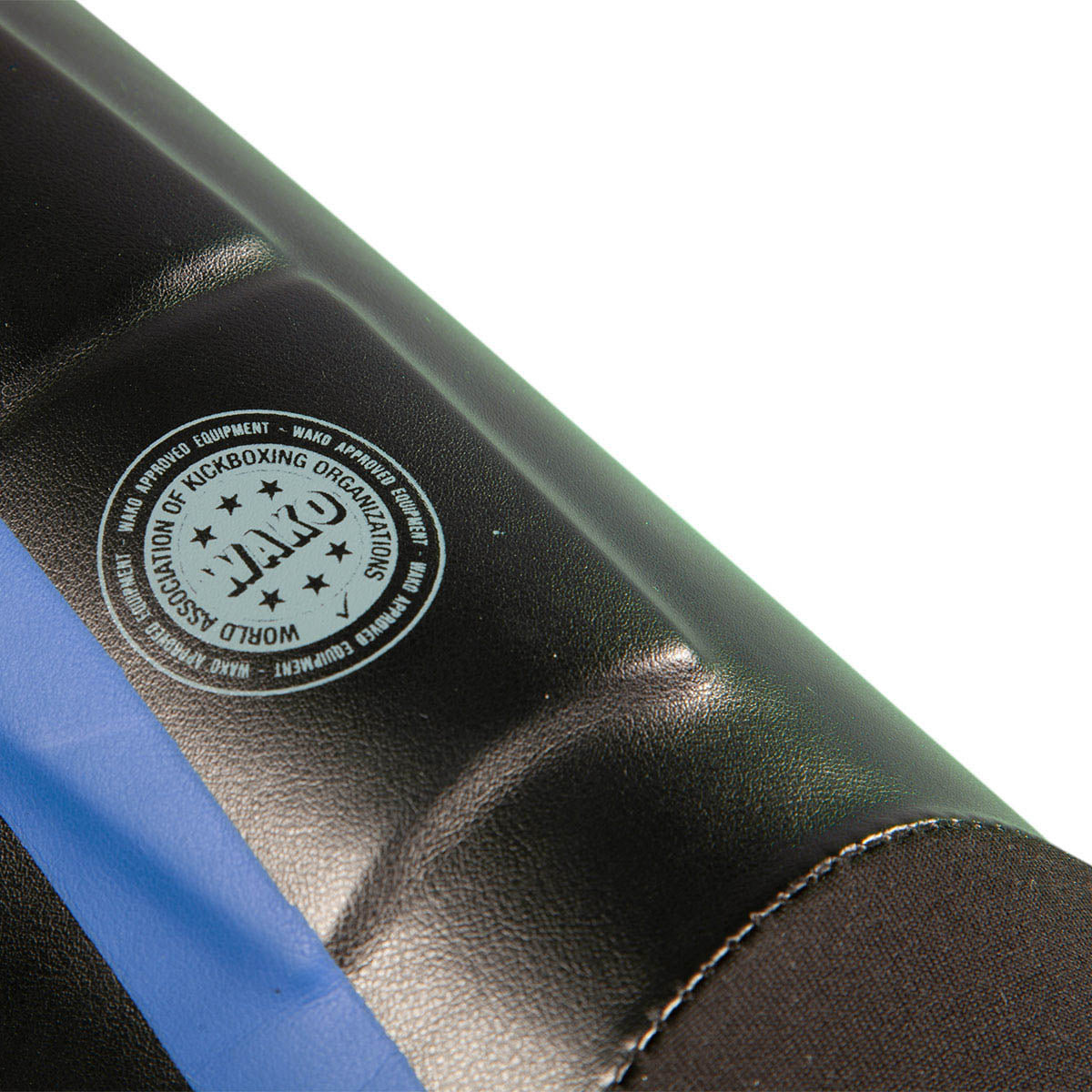 Black shin instep guard with blue stripe and circular emblem patch