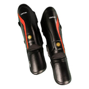 Black boxing shin guards with red stripe and hook-and-loop side straps