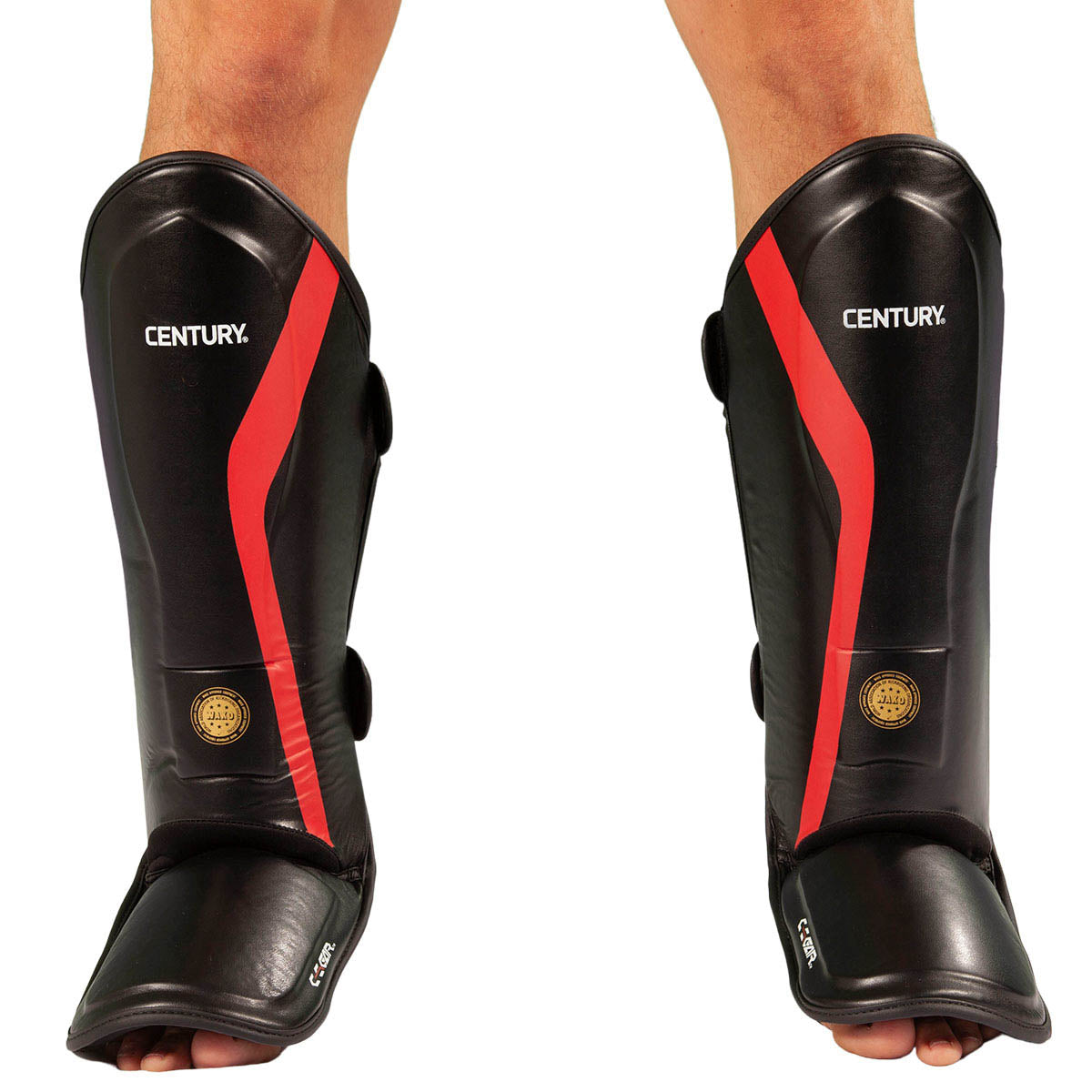 Black shin instep guards on legs with red stripes, CENTURY branding, and side straps