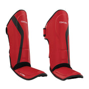 Red shin instep protectors with black base pads and hook-and-loop strap tabs
