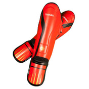 Pair of red shin and instep guards with black edging and Century logo