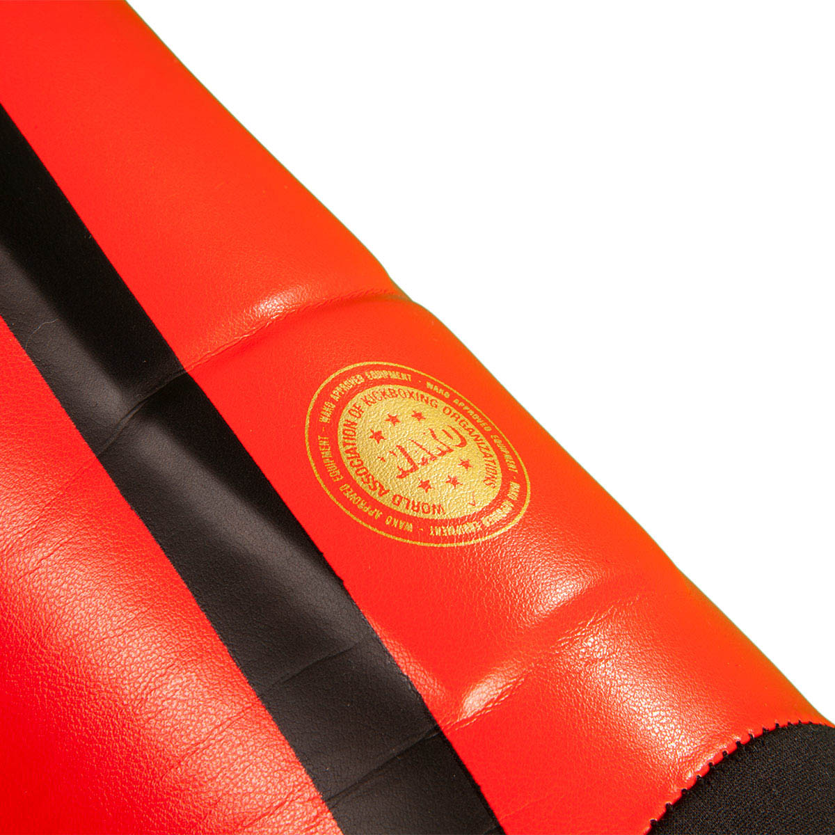 Red shin guard with gold seal logo and black center strap