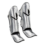 Silver glossy shin guards pair with V logo and adjustable side fastening