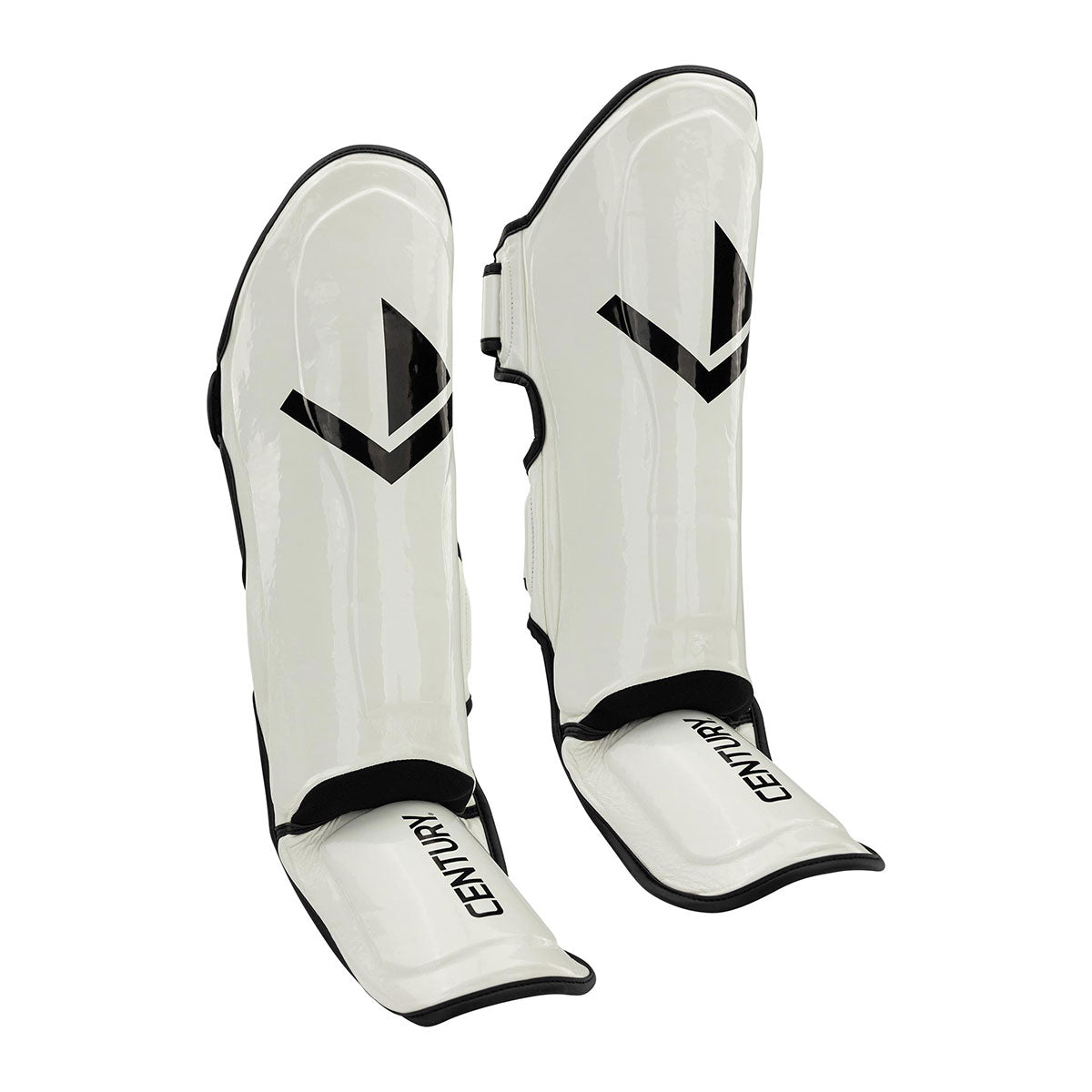 White glossy shin guards pair with V logo and black-edged adjustable straps
